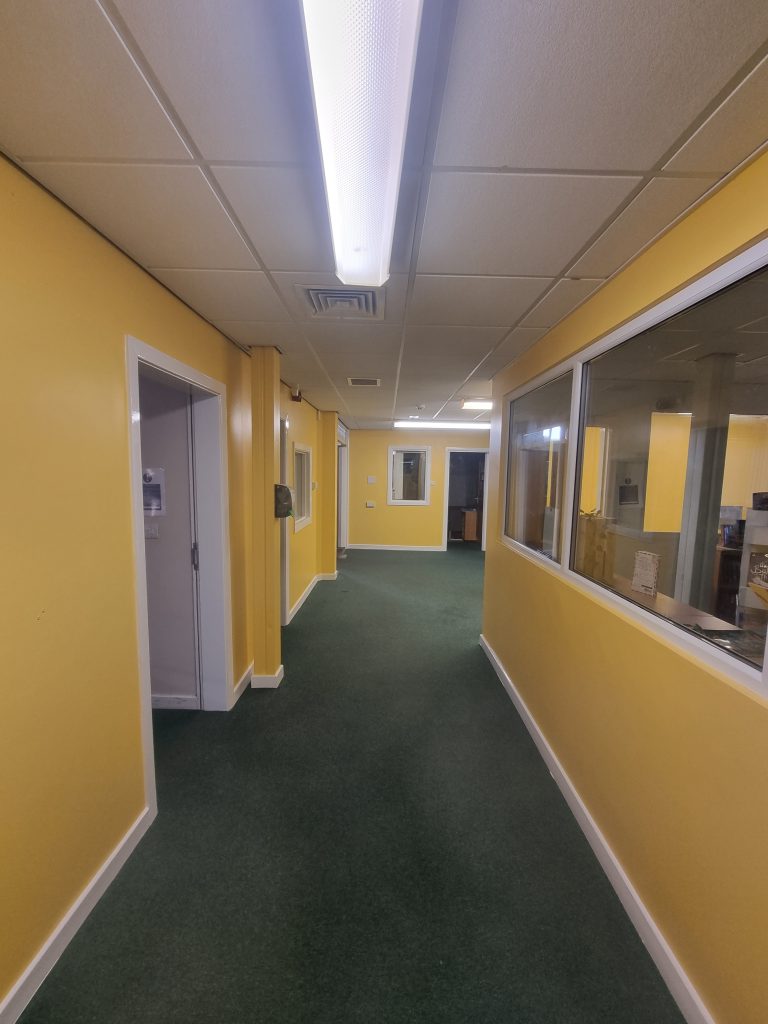 hallway with yellow painted walls scaled