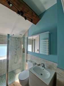 a bathroom painted in a nautical blue rotated