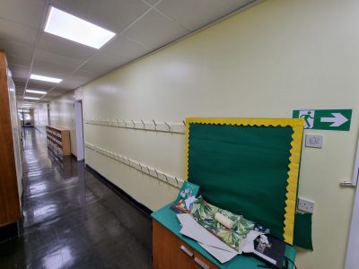 a painted hallway of a school corridor scaled