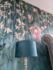a wall featuring a floral wallpaper decorated by mc painters rotated