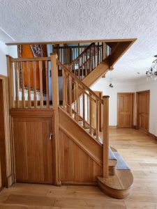 a wooden staircase painted by mc painters rotated