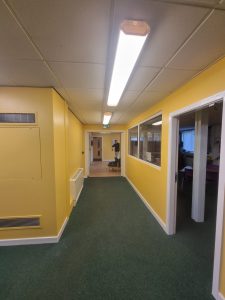 office with mostly yellow walls painted by mc painters scaled