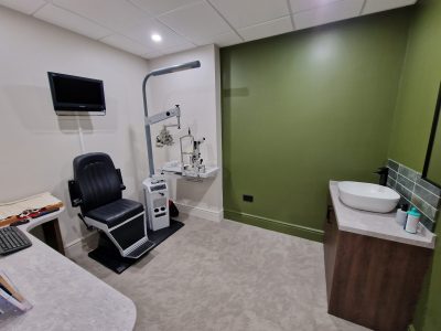 office with one green feature wall showing scaled