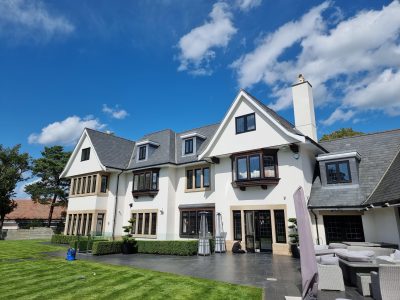 painted exterior of a three storey contemporary home painted by mc painters