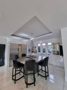 the white ceiling of a contemporary kitchen painted by mc painters