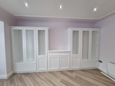 white wardrobes in a lilac room painted by mc painters
